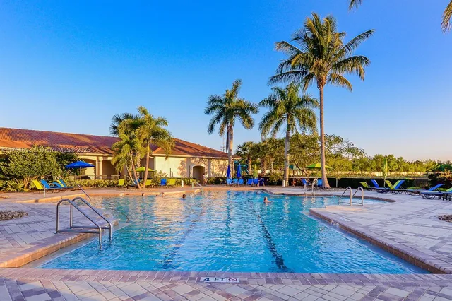 a view of outdoor space with palm trees