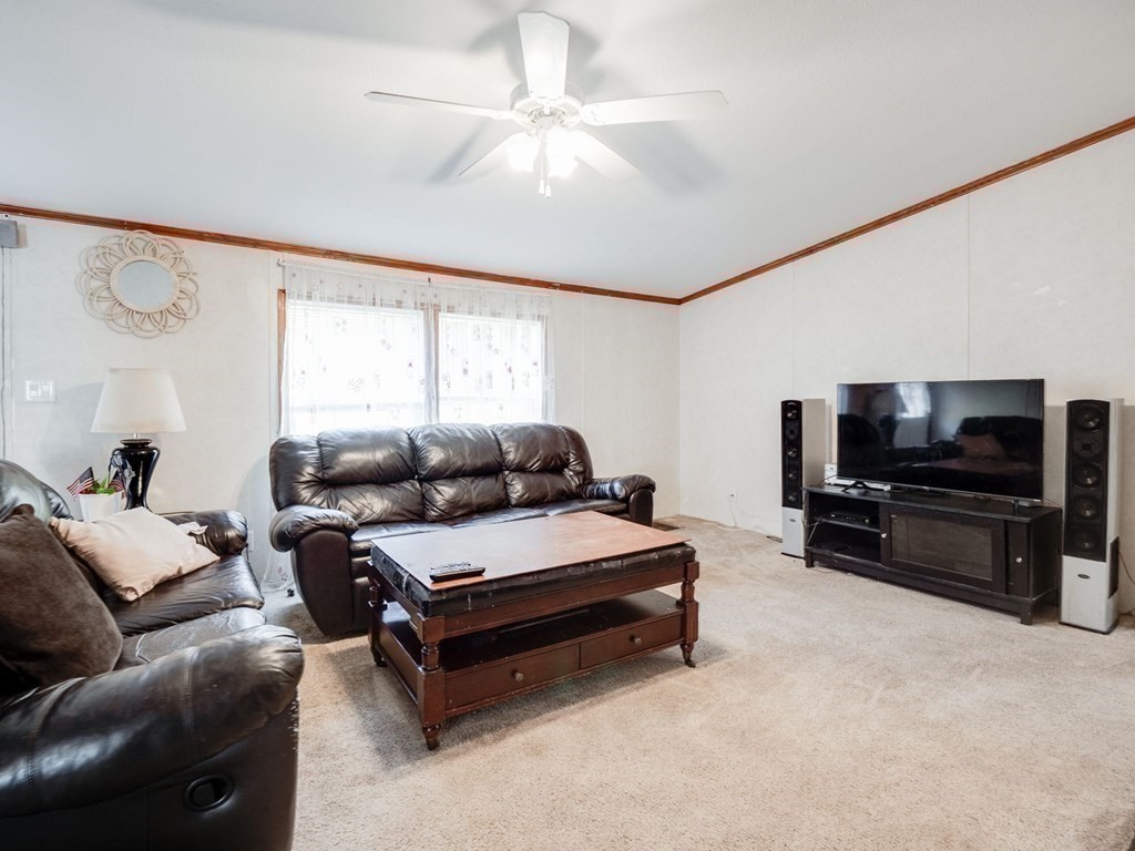 17 Medallion Road Holbrook, MA 02343 - Photo 16 of 39 a living room with furniture and a flat screen tv