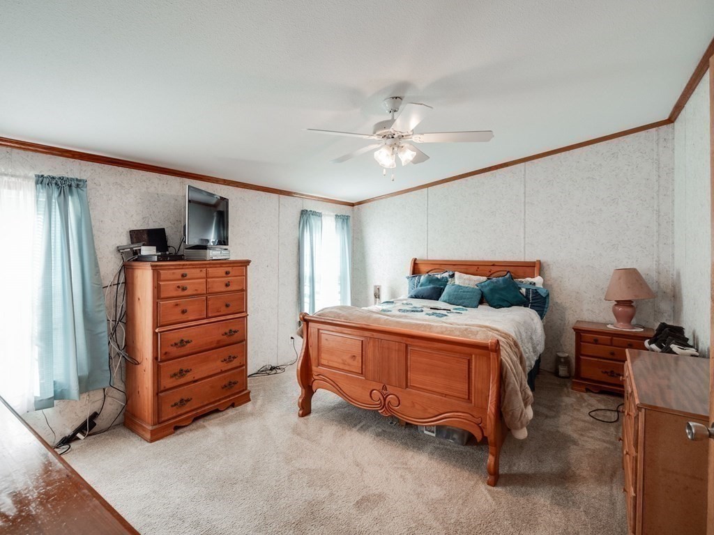 17 Medallion Road Holbrook, MA 02343 - Photo 19 of 39 a bedroom with a bed and dresser