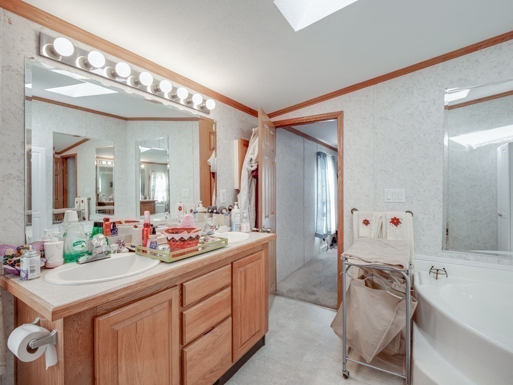 17 Medallion Road Holbrook, MA 02343 - Photo 23 of 39 a bathroom with a sink vanity granite tub and shower