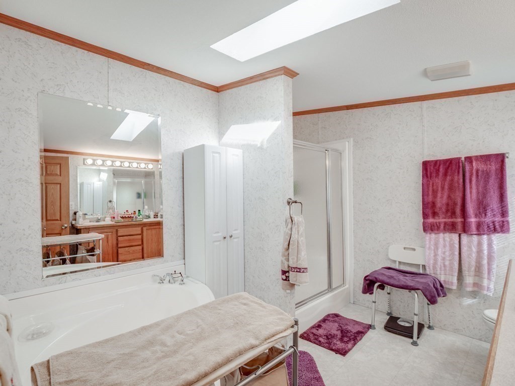 17 Medallion Road Holbrook, MA 02343 - Photo 24 of 39 a bedroom with a bed and furniture
