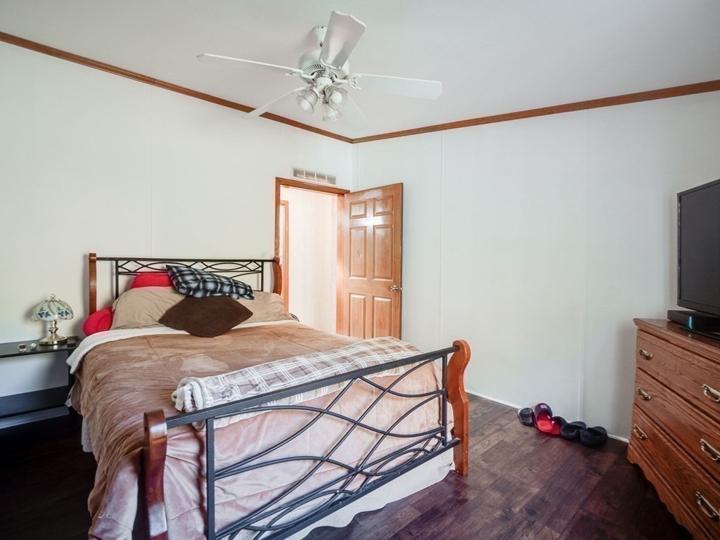 17 Medallion Road Holbrook, MA 02343 - Photo 25 of 39 a bedroom with a bed and a flat screen tv