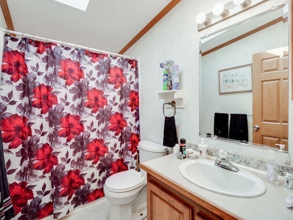 17 Medallion Road Holbrook, MA 02343 - Photo 31 of 39 a bathroom with a sink and a mirror with toilet