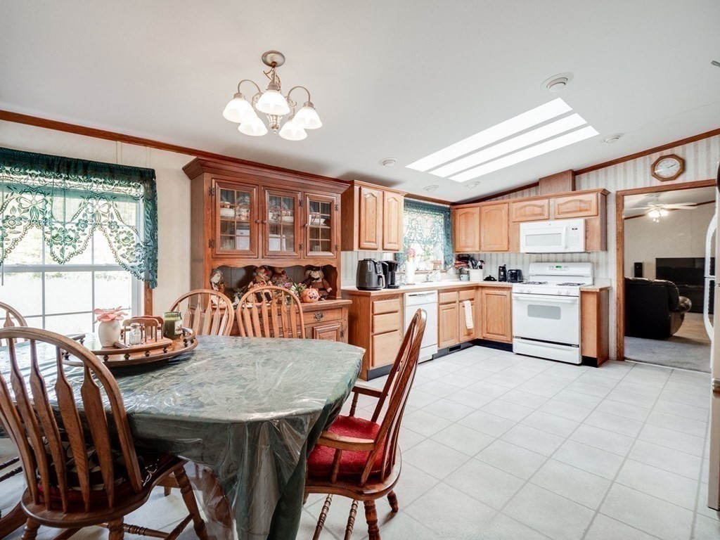 17 Medallion Road Holbrook, MA 02343 - Photo 8 of 39 a view of a dining room with furniture window and wooden floor