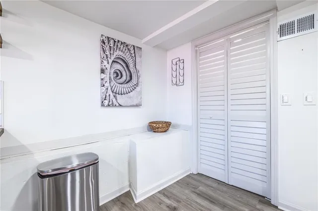 a kitchen with a refrigerator and cabinets