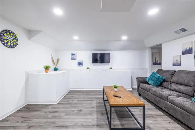 a room with furniture and flat screen tv