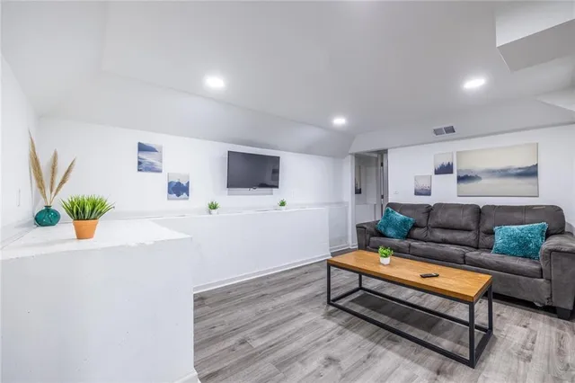a bathroom with a shower and a sink