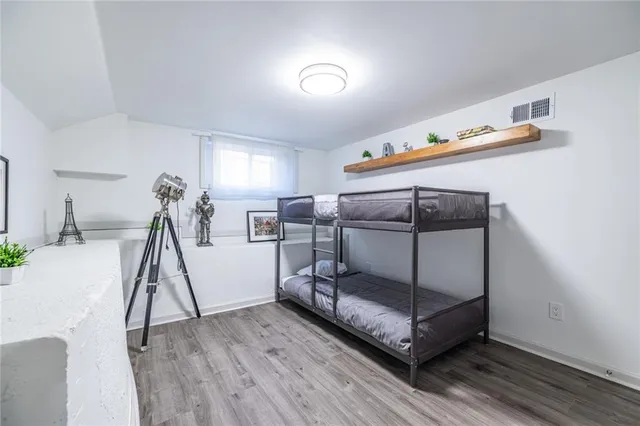 a bedroom with a bed and hallway