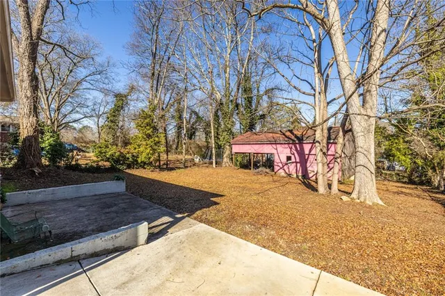 a view of a yard with snow on the road