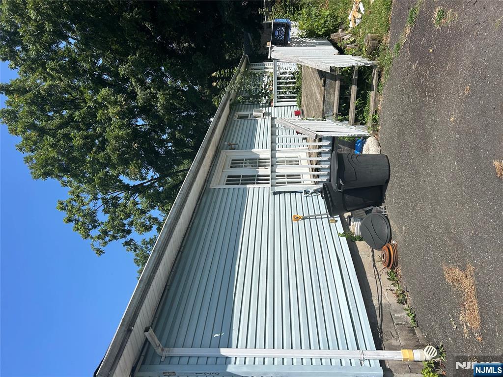 a view of a chair and tables in the back yard