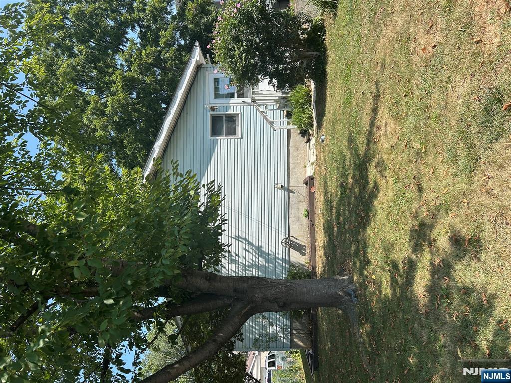 128 Grove Street Mahwah, NJ 07430 - Photo 2 of 5 a view of a yard in front of house