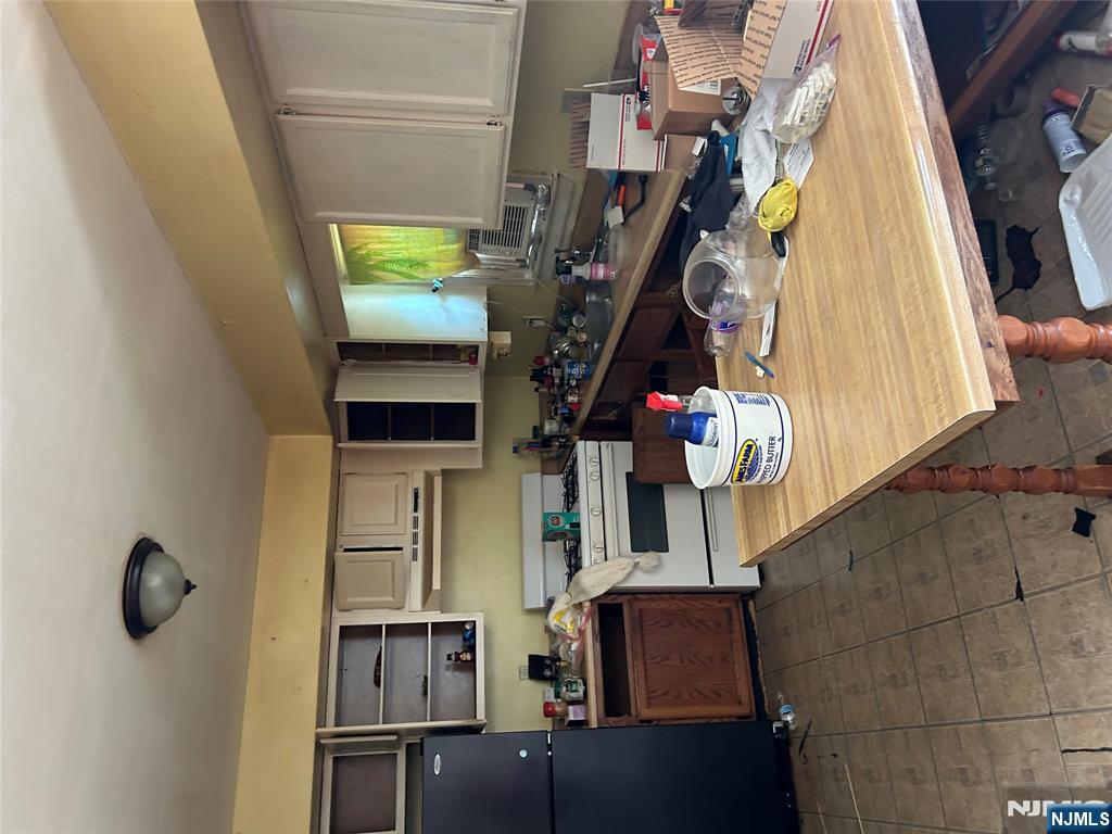 128 Grove Street Mahwah, NJ 07430 - Photo 4 of 5 a kitchen with a table and chairs in it