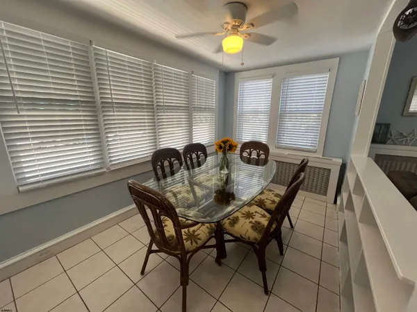 a view of a dining room with furniture and window