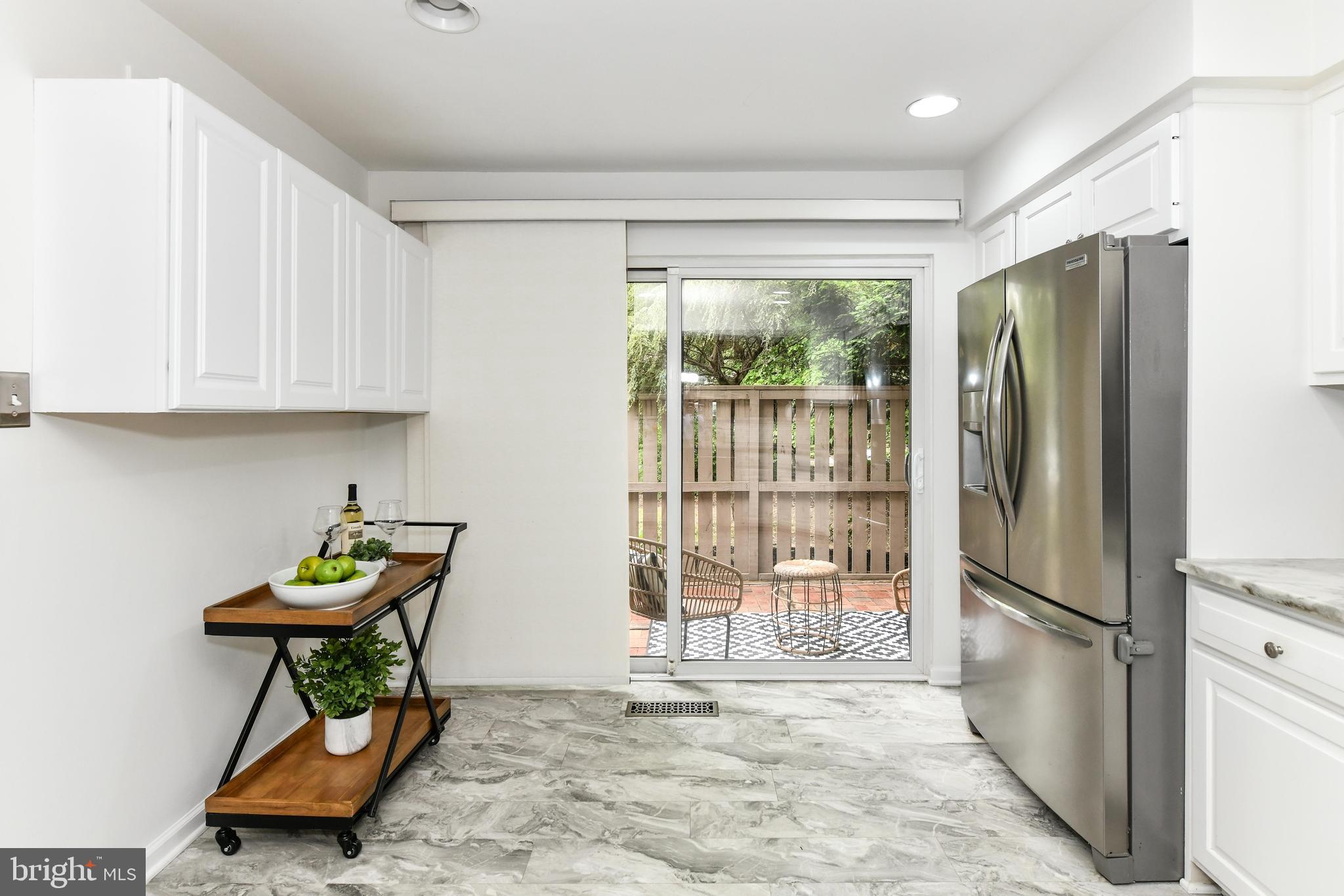 11701 Newbridge Court Reston, VA 20191 - Photo 6 of 64 Walk-out to front patio and grill off the kitchen!