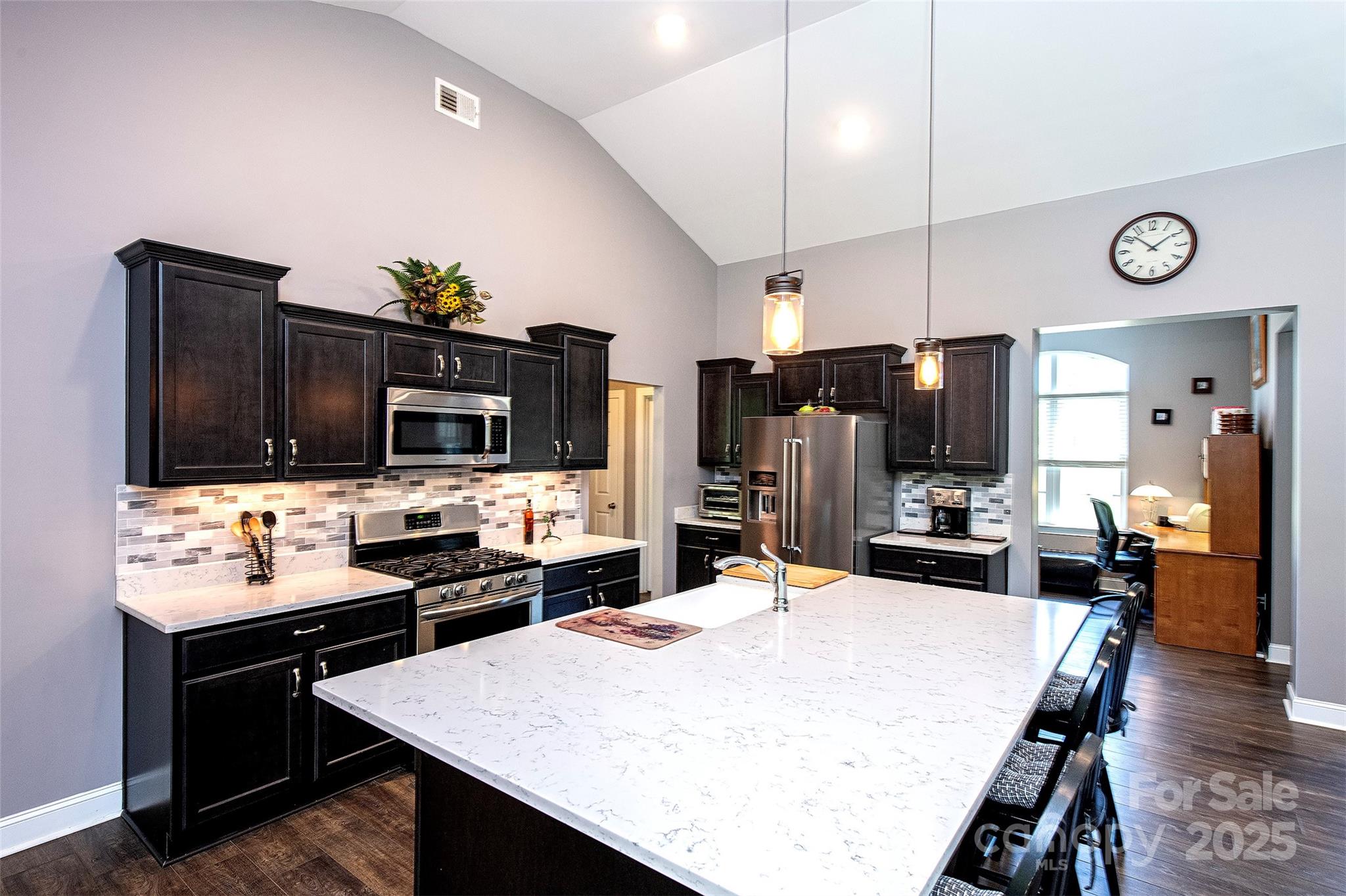 340 Hound Holw Road Camden, SC 29020 - Photo 12 of 28 a kitchen with refrigerator and chairs