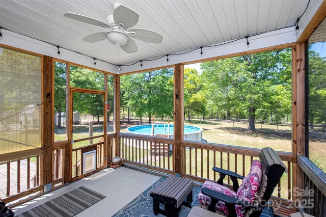 a view of a porch with furniture and a porch