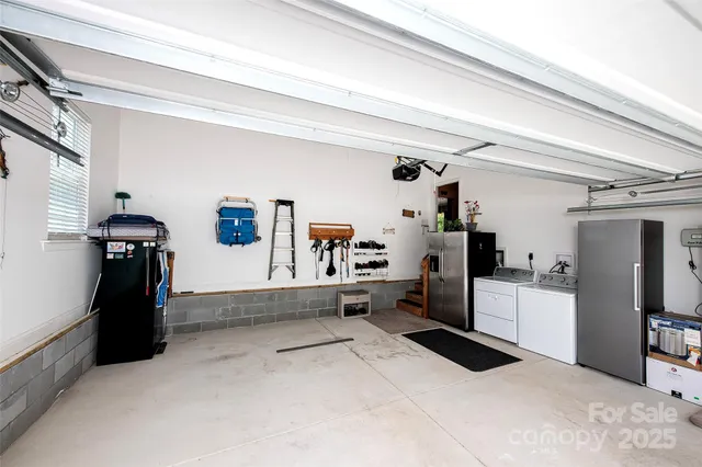 a kitchen with refrigerator and window