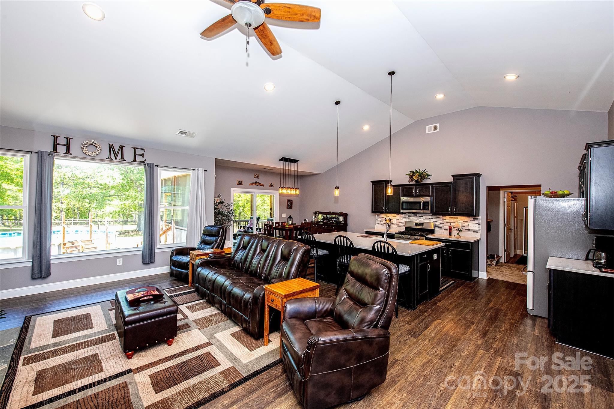 340 Hound Holw Road Camden, SC 29020 - Photo 8 of 28 a living room with furniture a flat screen tv and a large window