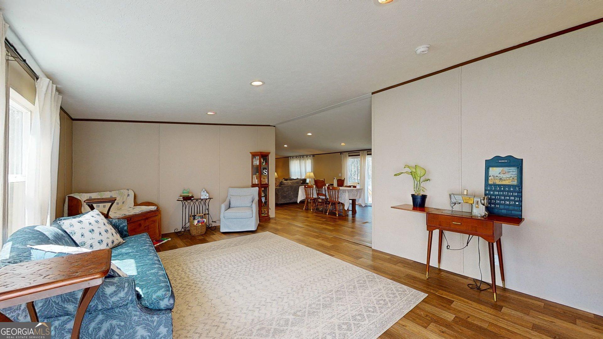 5571 Old Dixie Highway South Springfield, GA 31329 - Photo 15 of 38 a living room with furniture and wooden floor