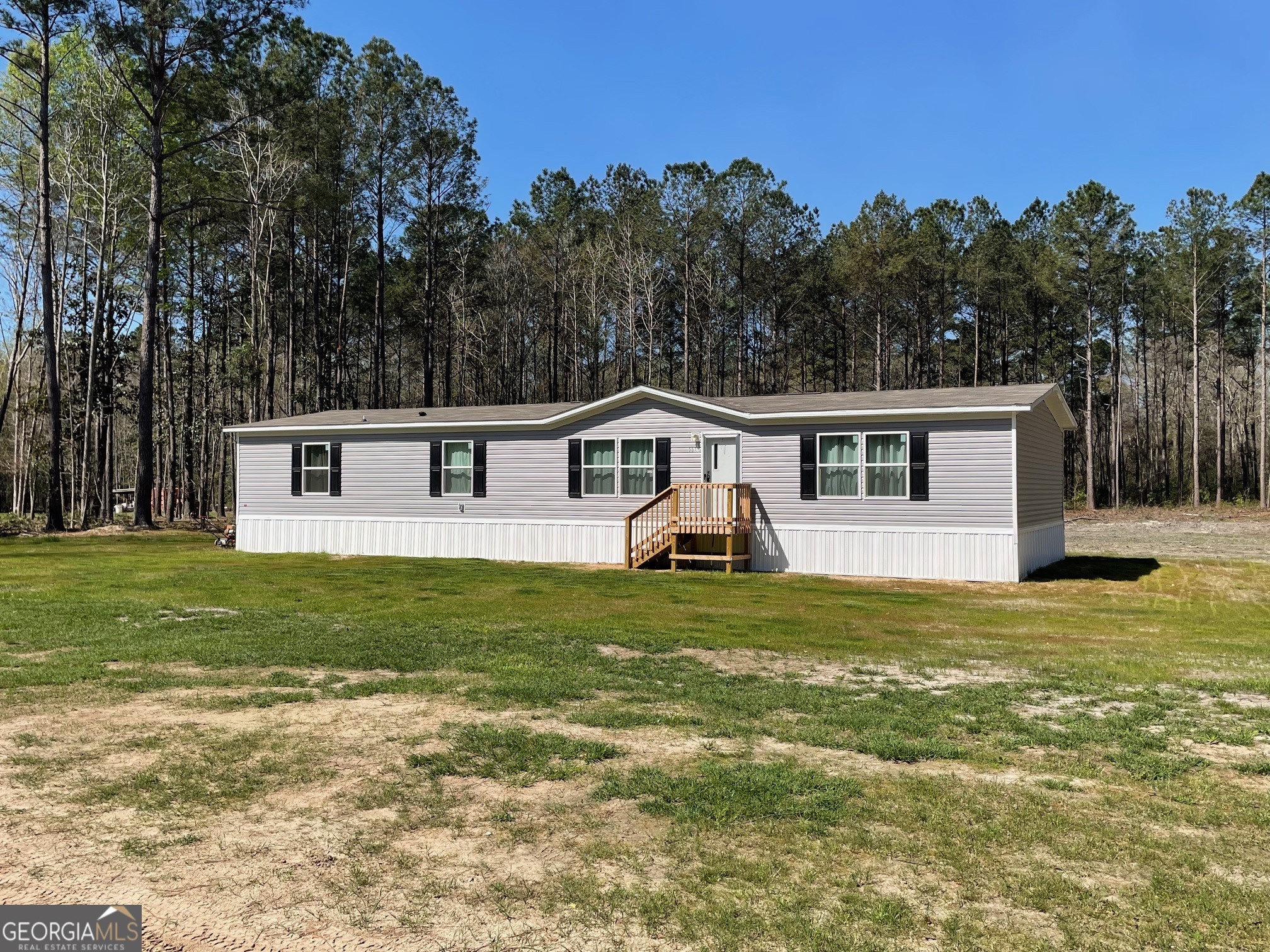 5571 Old Dixie Highway South Springfield, GA 31329 - Photo 2 of 38 a front view of a house with a yard