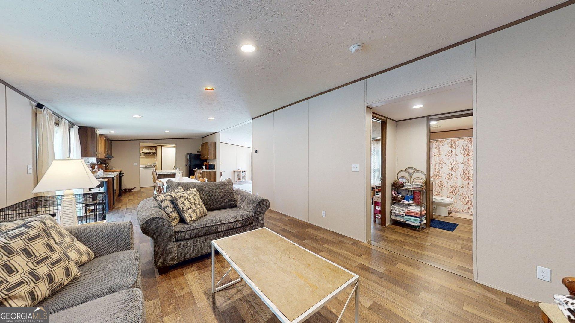 5571 Old Dixie Highway South Springfield, GA 31329 - Photo 21 of 38 a living room with furniture and a wooden floor