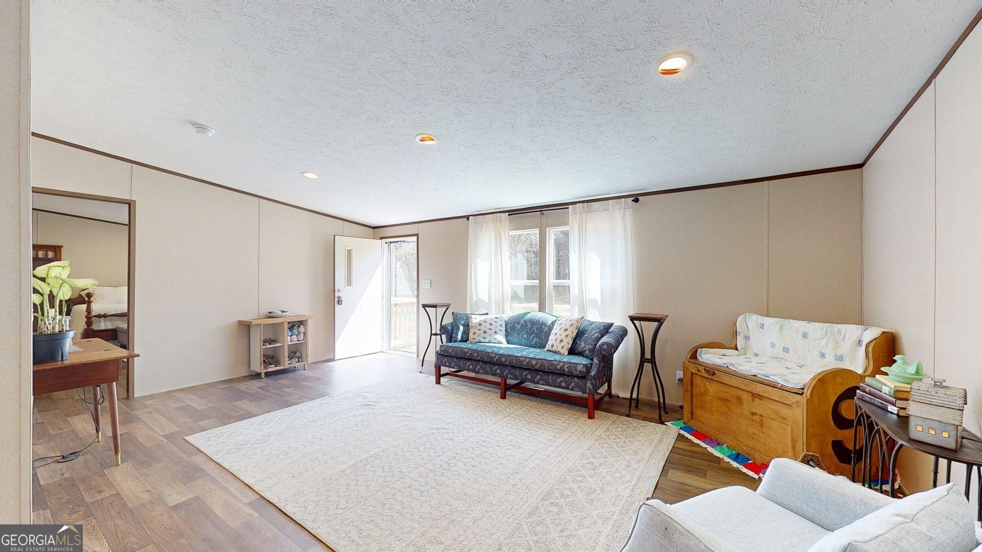 5571 Old Dixie Highway South Springfield, GA 31329 - Photo 25 of 38 a living room with furniture and a window