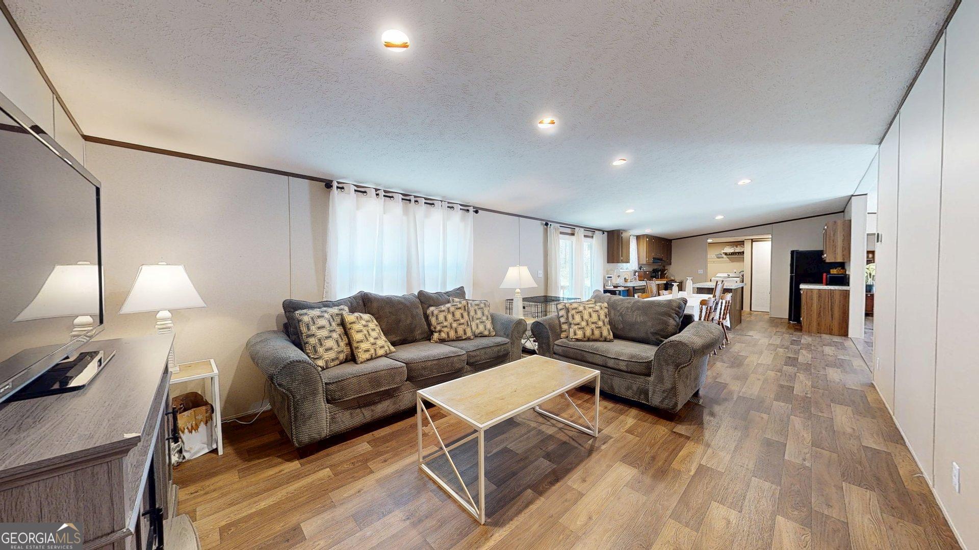 5571 Old Dixie Highway South Springfield, GA 31329 - Photo 28 of 38 a living room with furniture and a lamp