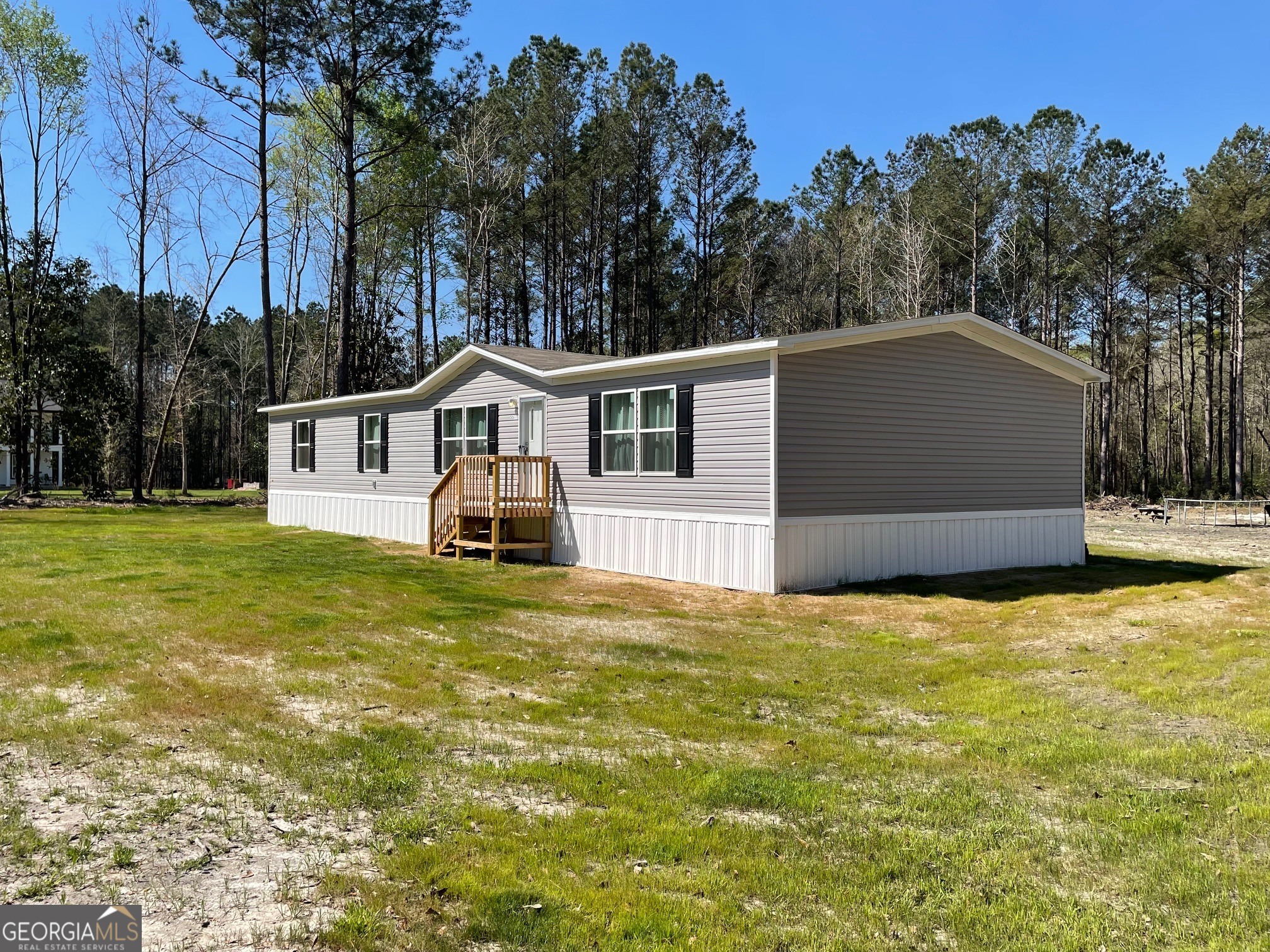 5571 Old Dixie Highway South Springfield, GA 31329 - Photo 3 of 38 a front view of a house with a yard and garage