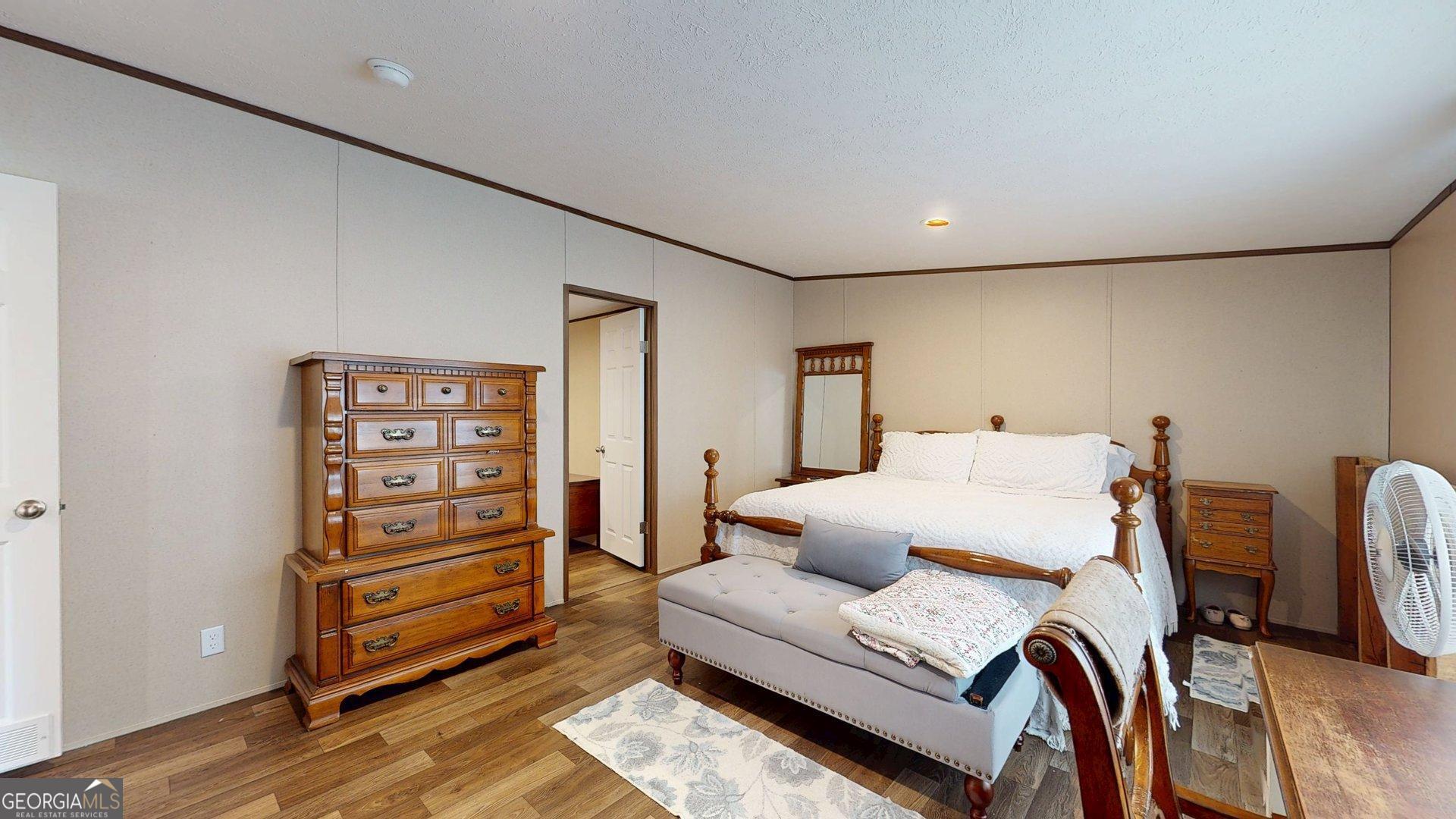 5571 Old Dixie Highway South Springfield, GA 31329 - Photo 32 of 38 a bedroom with furniture and a dresser