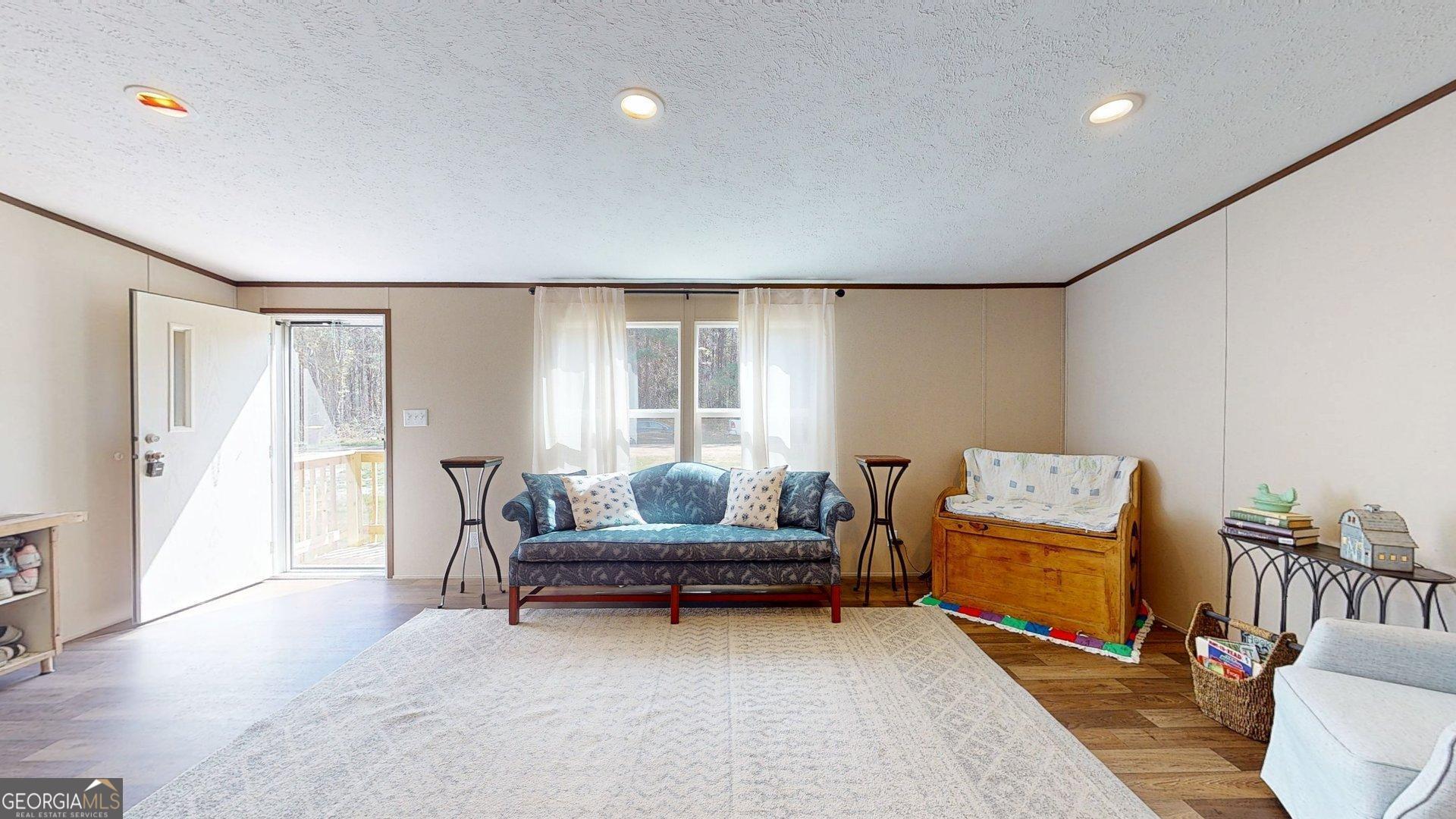 5571 Old Dixie Highway South Springfield, GA 31329 - Photo 33 of 38 a living room with furniture and a potted plant