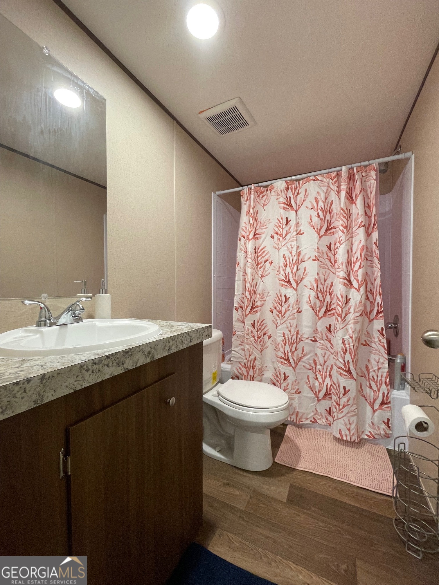 5571 Old Dixie Highway South Springfield, GA 31329 - Photo 5 of 38 a bathroom with a granite countertop toilet sink and mirror