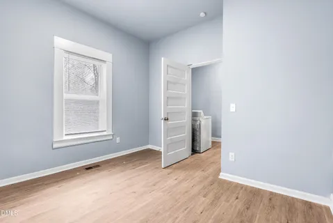 a bathroom with a double vanity sink mirror and toilet