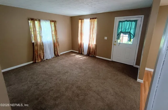 an empty room with windows