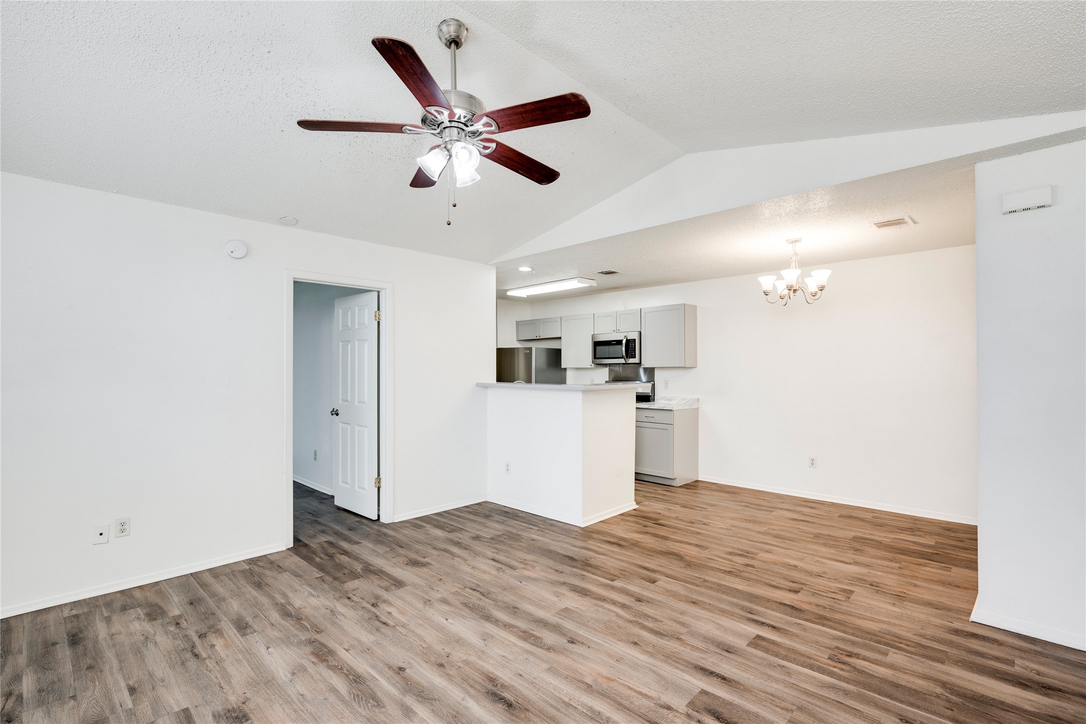 7918 West Gate Boulevard Austin, TX 78745 - Photo 14 of 31 An inviting open-concept living area with contemporary flooring and a seamless kitchen flow.