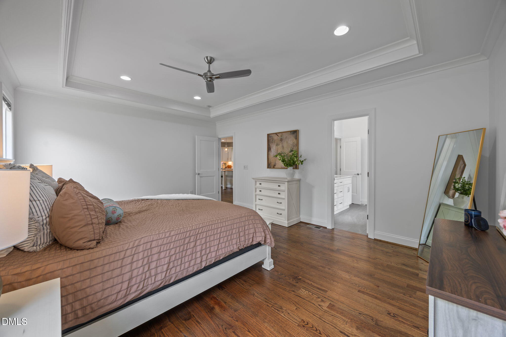 804 Hartford Road Raleigh, NC 27610 - Photo 11 of 26 a bedroom with a bed and a flat tv screen on the dresser
