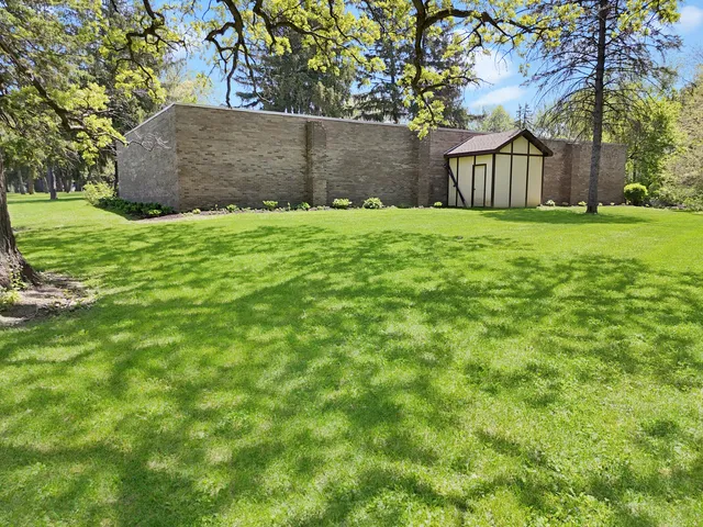 a bedroom with a large bed and a large window