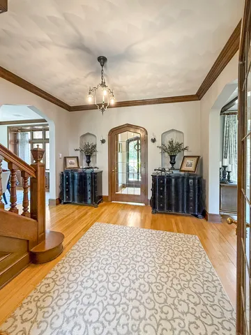 a bathroom with a sink a toilet a window and a mirror