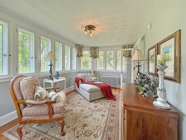 a view of house with outdoor seating space and wooden floor