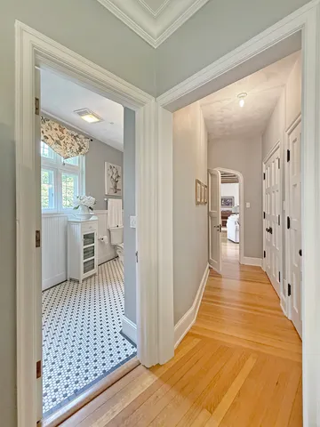 a bathroom with a glass door shower and a toilet