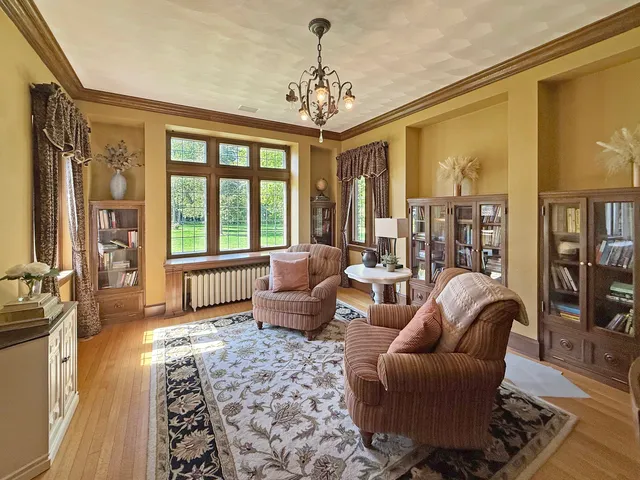 a bedroom with furniture and a window