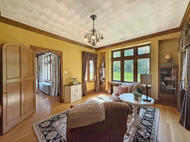 a bedroom with furniture and a window