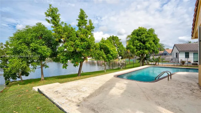 a view of a swimming pool with a patio