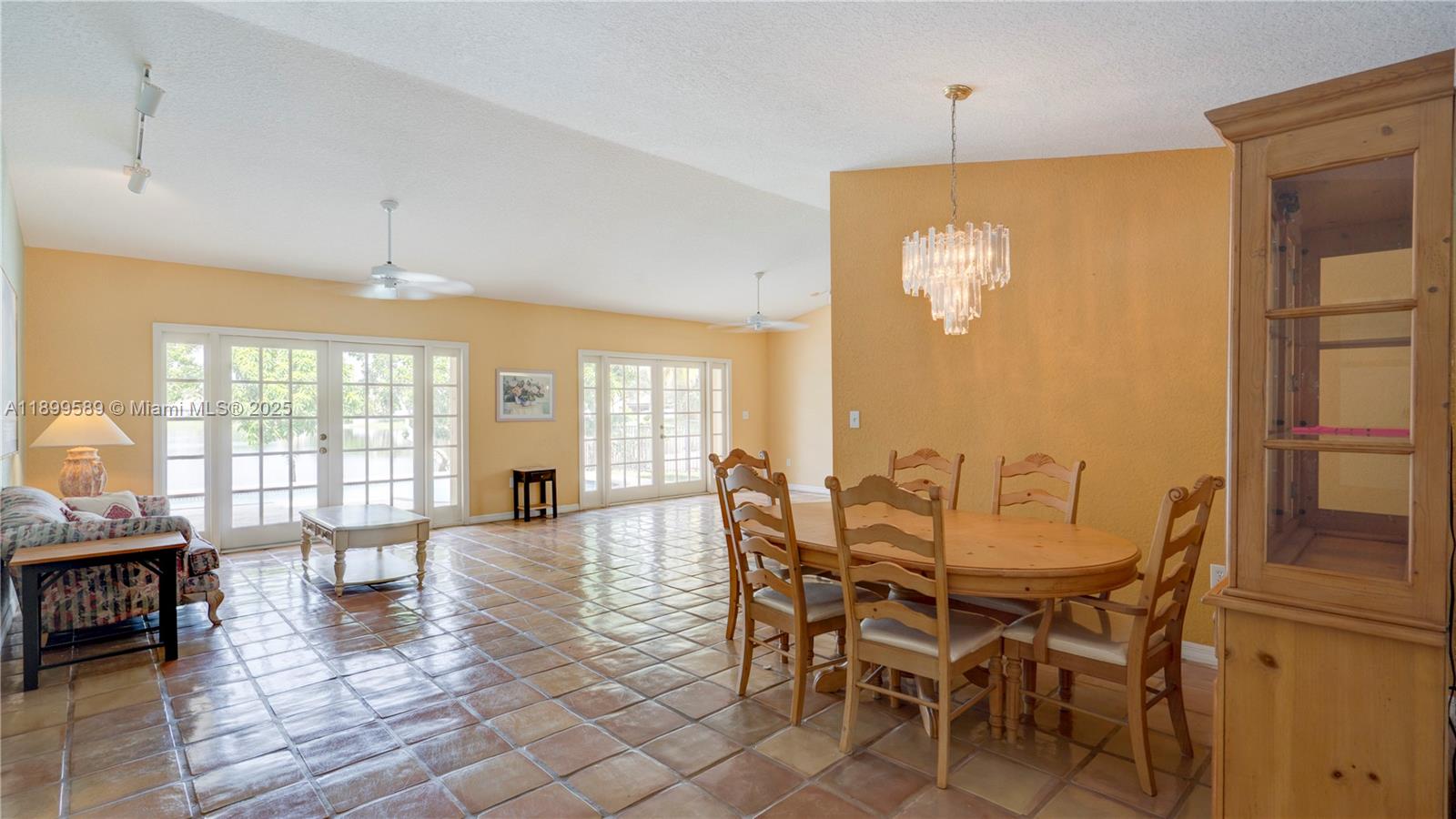 6255 Hawkes Bluff Avenue Davie, FL 33331 - Photo 19 of 51 a view of a dining room with furniture wooden floor and chandelier