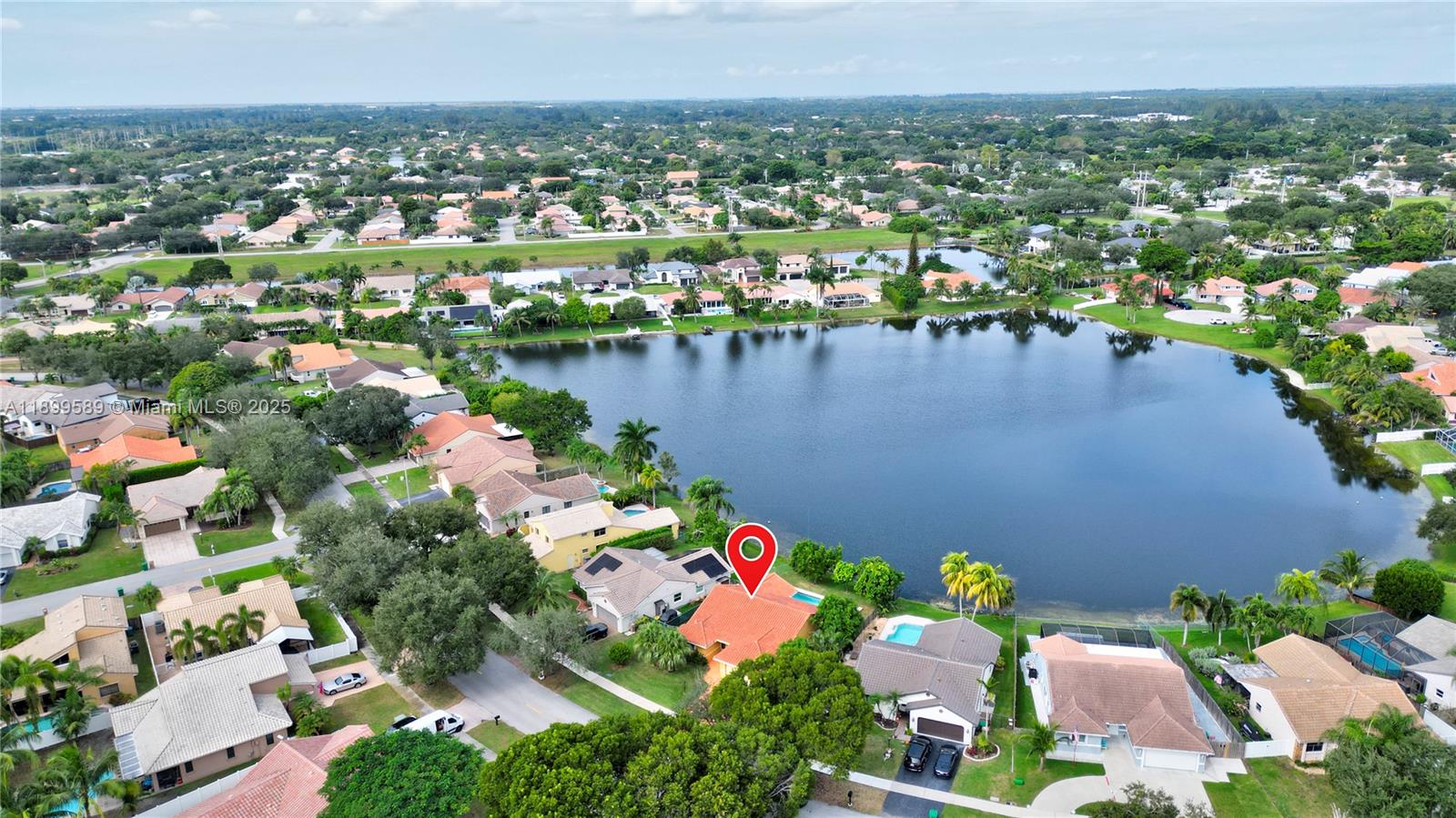 6255 Hawkes Bluff Avenue Davie, FL 33331 - Photo 3 of 51 an aerial view of city and lake view