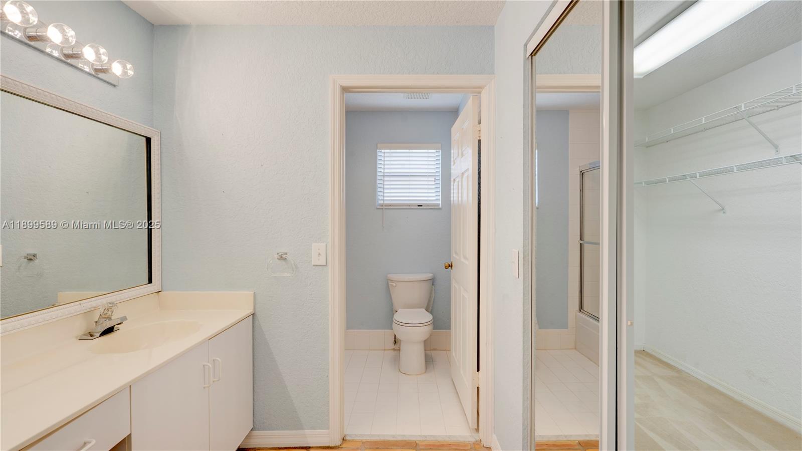 6255 Hawkes Bluff Avenue Davie, FL 33331 - Photo 40 of 51 a bathroom with a sink a toilet and shower
