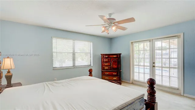 a view of a bedroom with a large window