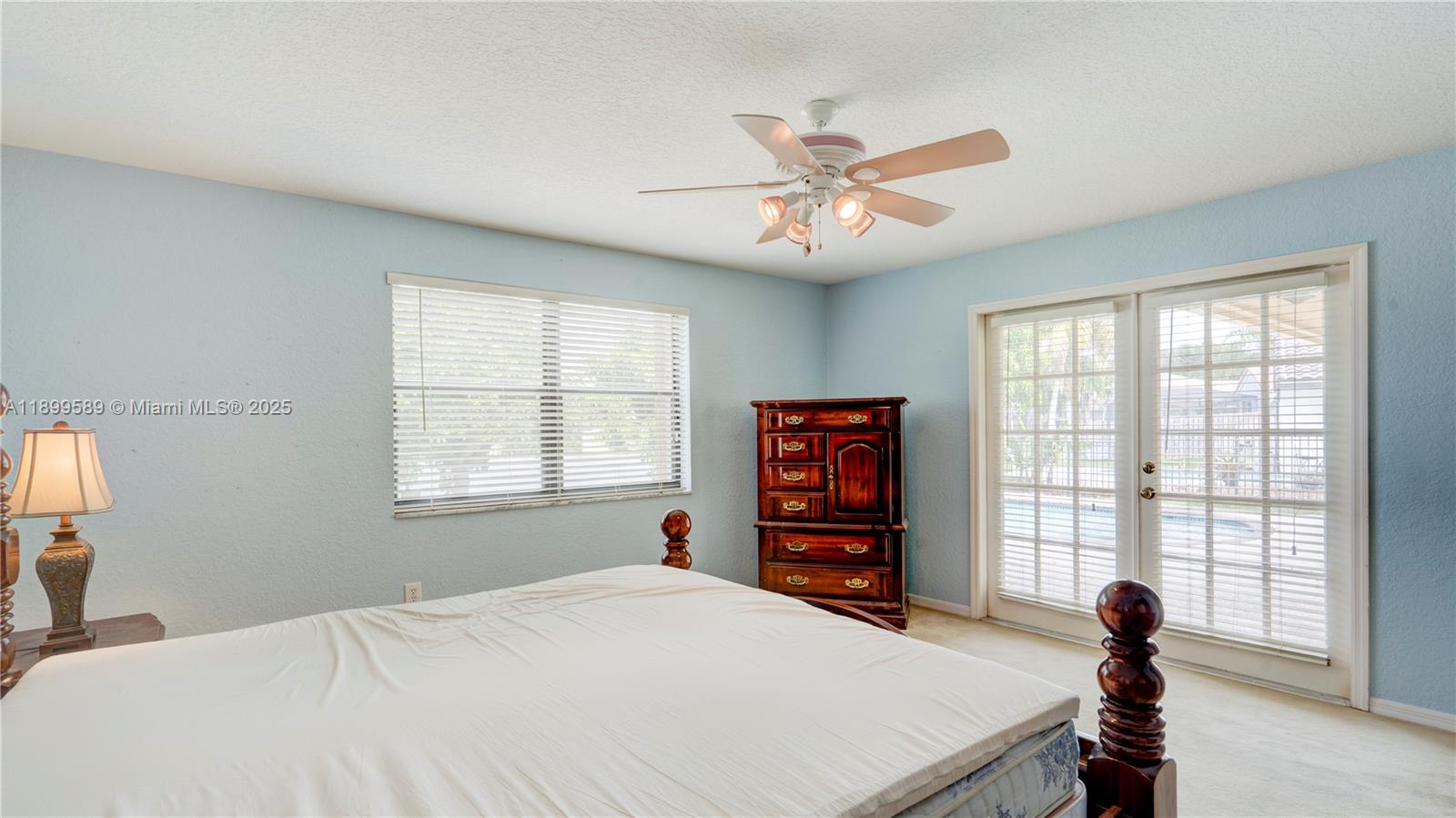 6255 Hawkes Bluff Avenue Davie, FL 33331 - Photo 44 of 51 a bedroom with a bed and a window