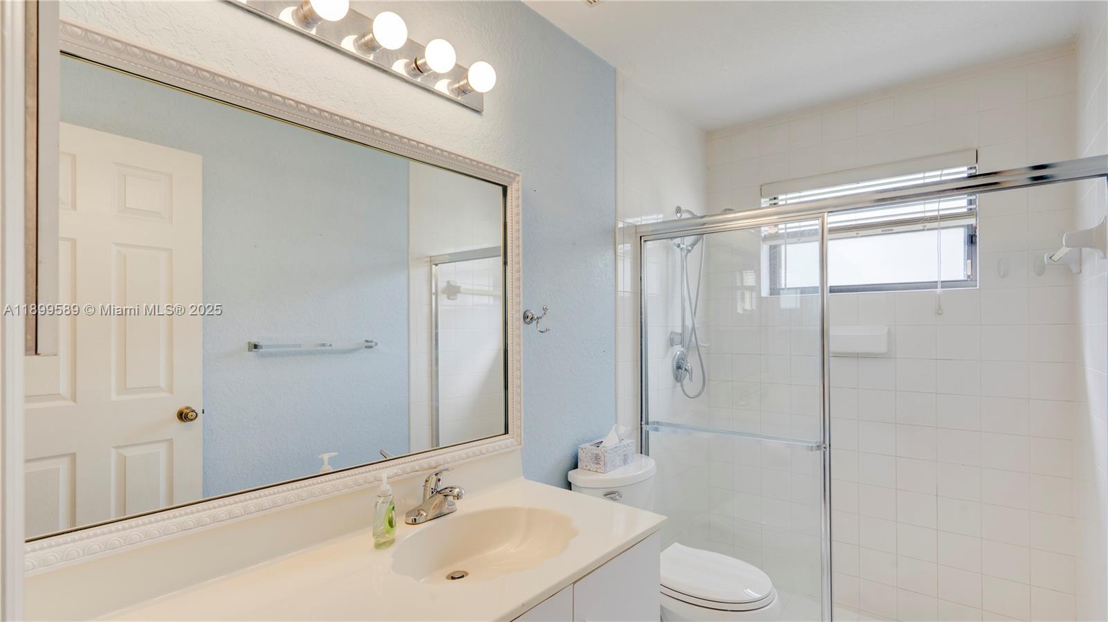 6255 Hawkes Bluff Avenue Davie, FL 33331 - Photo 47 of 51 a bathroom with a sink toilet and shower