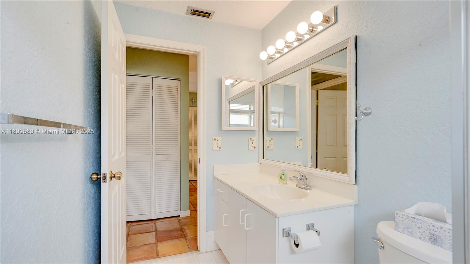 6255 Hawkes Bluff Avenue Davie, FL 33331 - Photo 48 of 51 a bathroom with a sink and a mirror