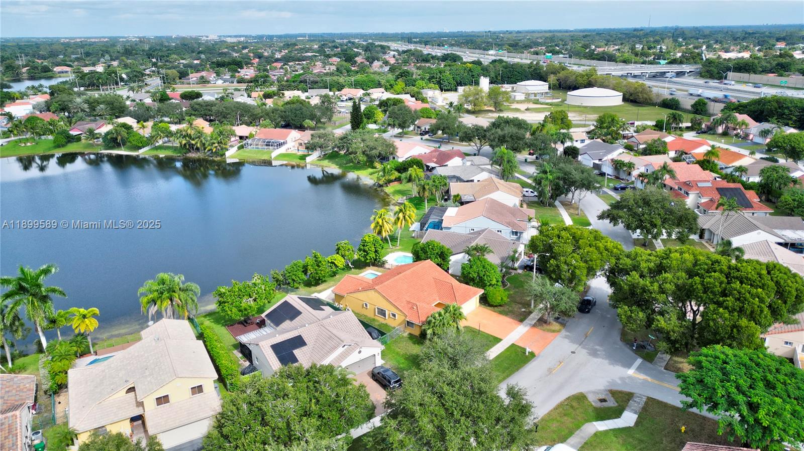 6255 Hawkes Bluff Avenue Davie, FL 33331 - Photo 5 of 51 an aerial view of residential houses with outdoor space and swimming pool
